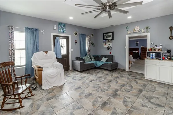 a living room with furniture and white walls