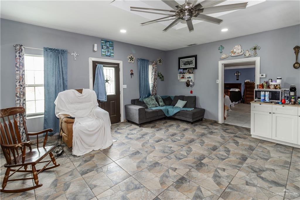 24724 Iowa Road Edinburg, TX 78541 - Photo 8 of 18 a living room with furniture and white walls