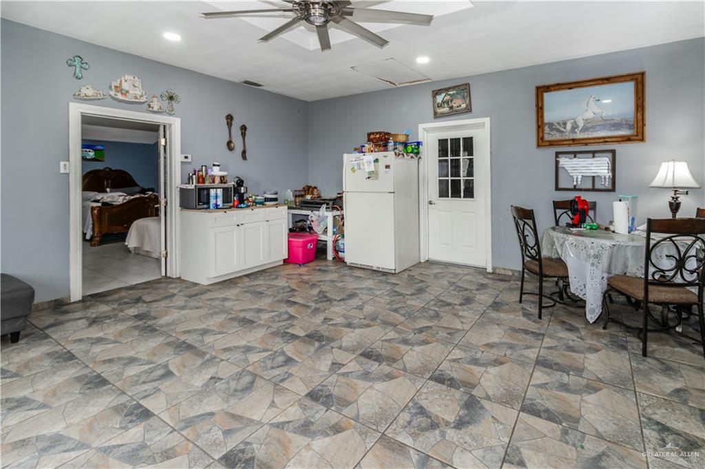 24724 Iowa Road Edinburg, TX 78541 - Photo 9 of 18 a view of a room with workspace and a window