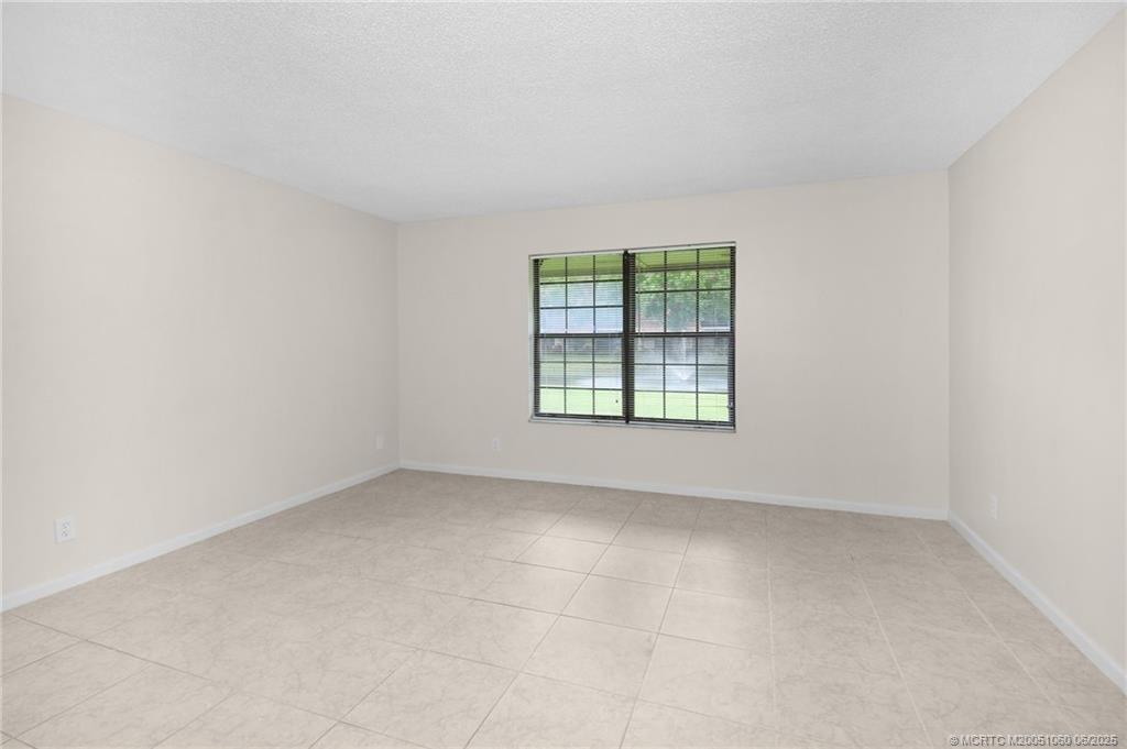 3100 Southeast Pruitt Road, Unit B105 Port St. Lucie, FL 34952 - Photo 12 of 40 an empty room with a window