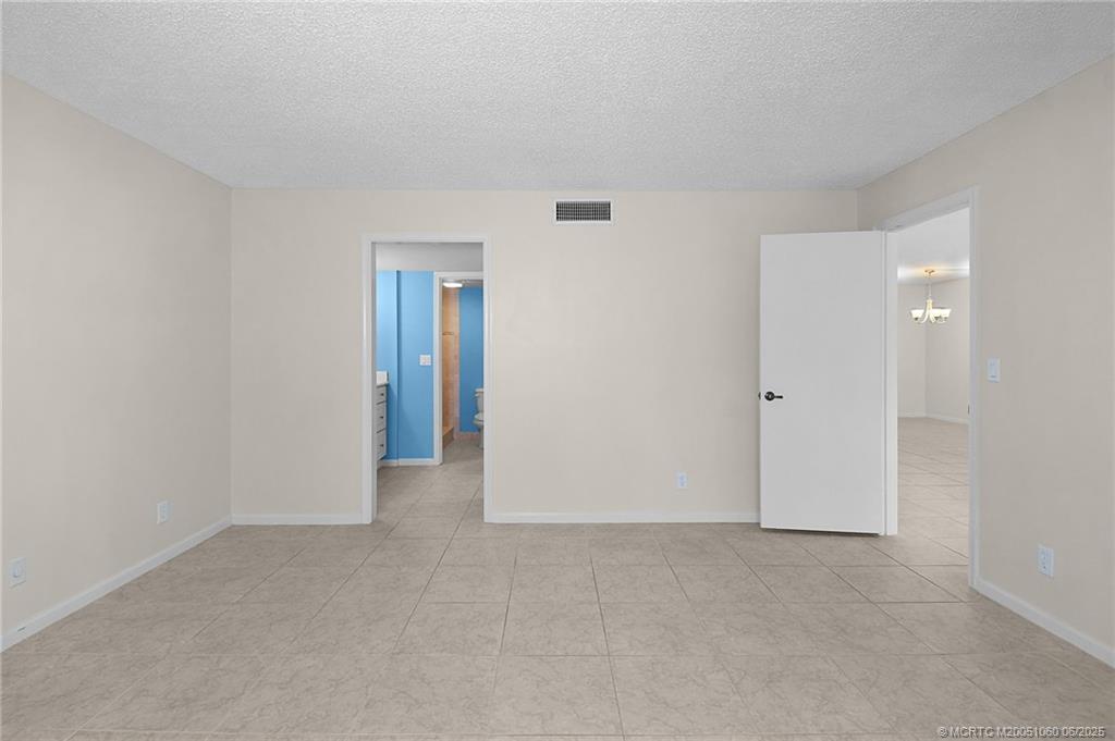 3100 Southeast Pruitt Road, Unit B105 Port St. Lucie, FL 34952 - Photo 13 of 40 a view of an empty room and closet area