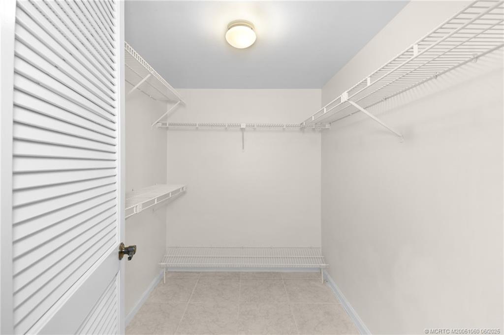3100 Southeast Pruitt Road, Unit B105 Port St. Lucie, FL 34952 - Photo 16 of 40 a view of an empty walk in closet