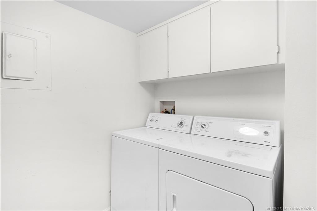 3100 Southeast Pruitt Road, Unit B105 Port St. Lucie, FL 34952 - Photo 22 of 40 a utility room with dryer and washer