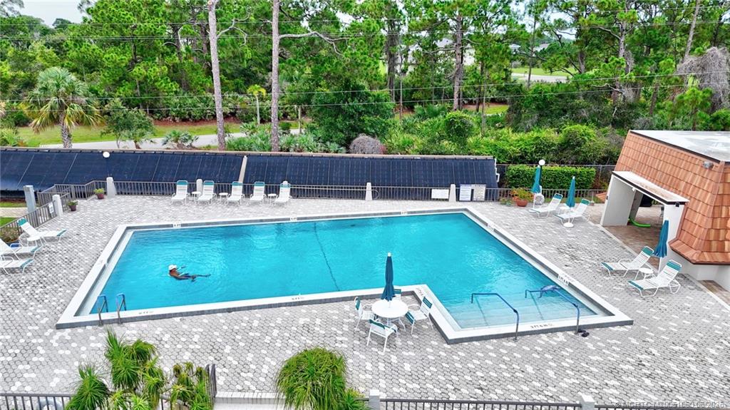 3100 Southeast Pruitt Road, Unit B105 Port St. Lucie, FL 34952 - Photo 25 of 40 swimming pool view with a seating space