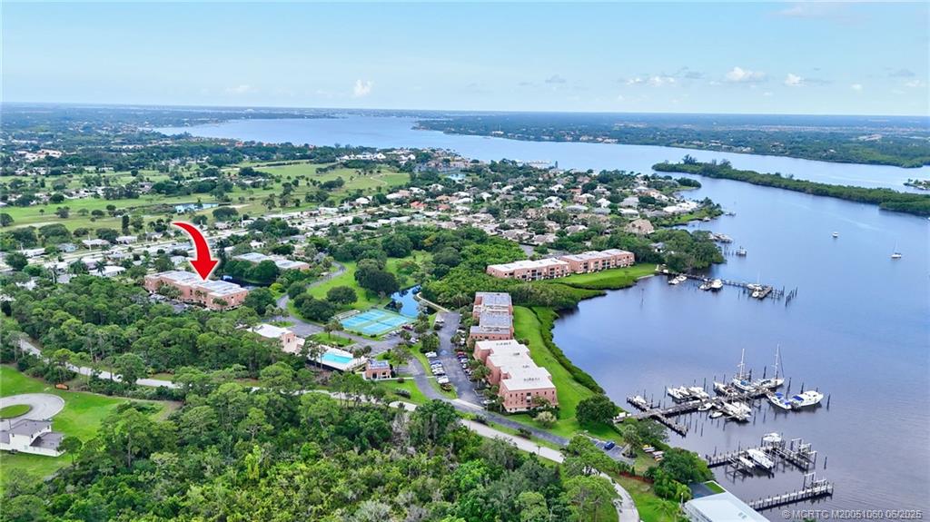 3100 Southeast Pruitt Road, Unit B105 Port St. Lucie, FL 34952 - Photo 27 of 40 an aerial view of a houses with a yard