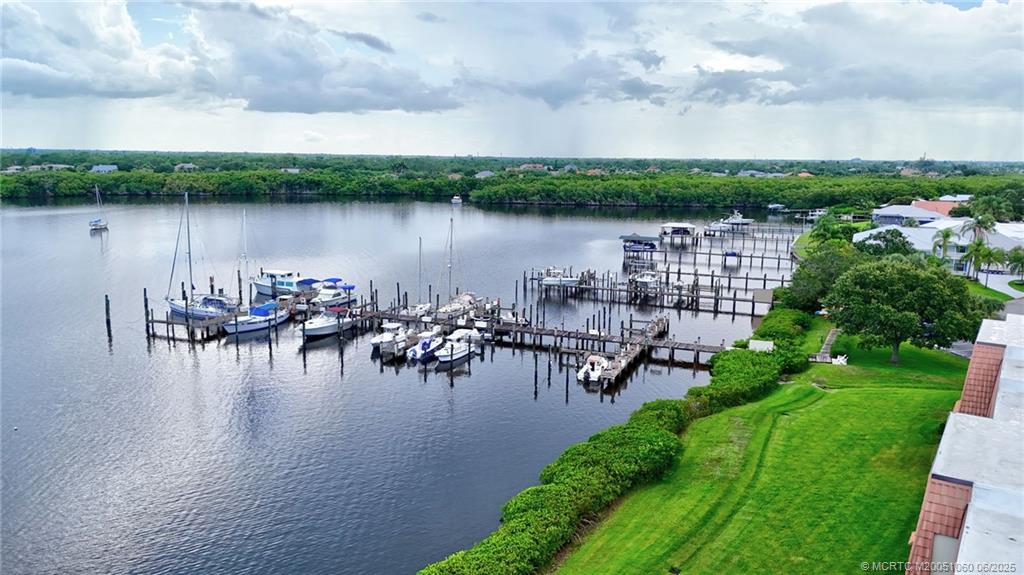 3100 Southeast Pruitt Road, Unit B105 Port St. Lucie, FL 34952 - Photo 31 of 40 a view of a lake with houses with outdoor space
