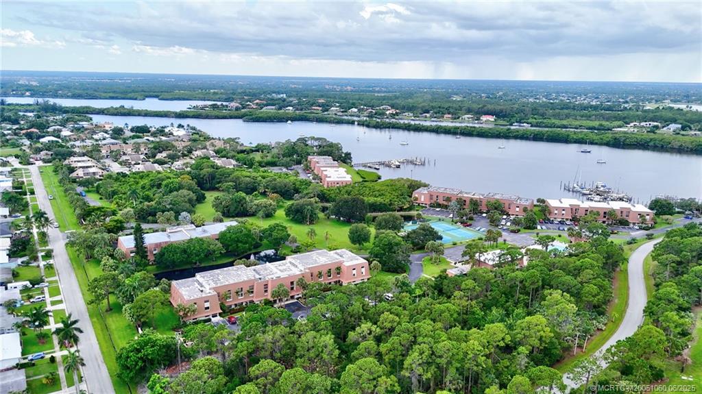 3100 Southeast Pruitt Road, Unit B105 Port St. Lucie, FL 34952 - Photo 32 of 40 a view of a lake with a city