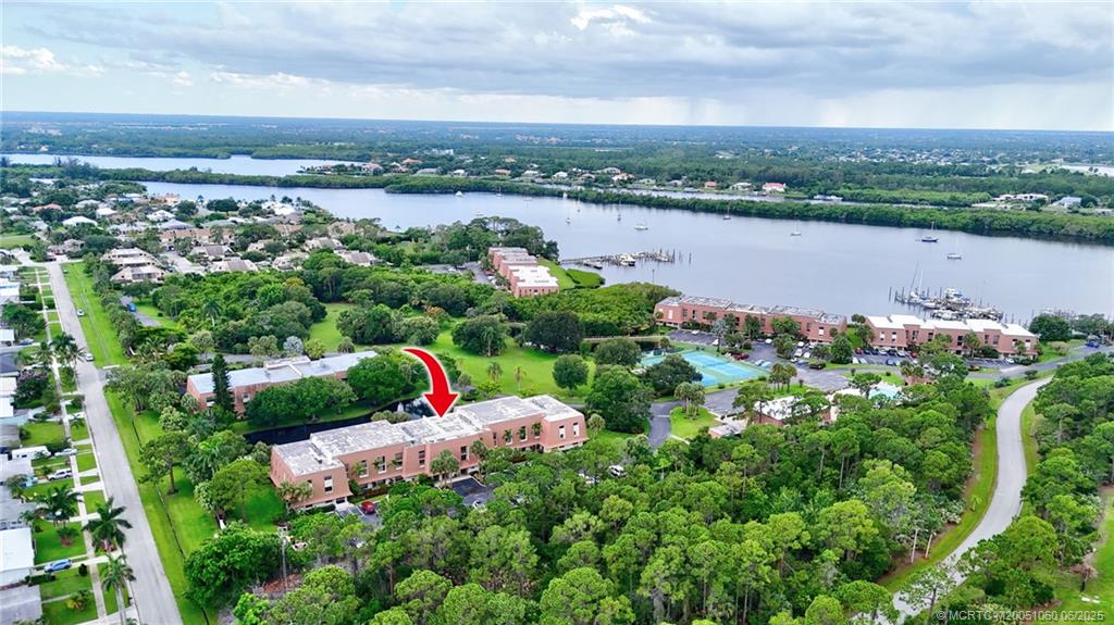 3100 Southeast Pruitt Road, Unit B105 Port St. Lucie, FL 34952 - Photo 35 of 40 an aerial view of a houses with outdoor space and lake view