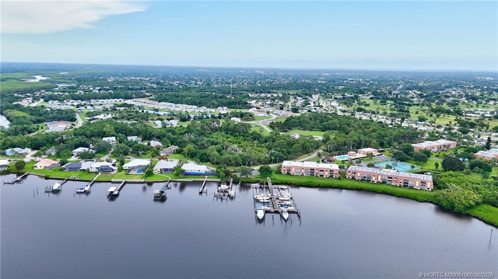 3100 Southeast Pruitt Road, Unit B105 Port St. Lucie, FL 34952 - Photo 37 of 40 an aerial view of a house with a garden