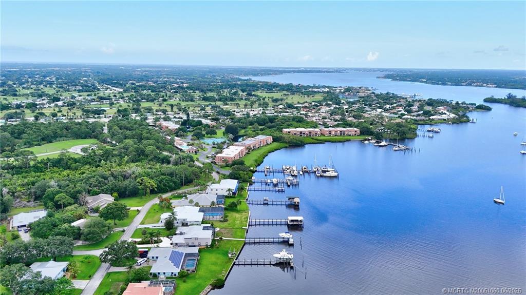 3100 Southeast Pruitt Road, Unit B105 Port St. Lucie, FL 34952 - Photo 39 of 40 an aerial view of a house with a yard