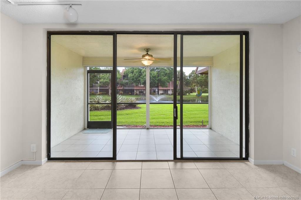 3100 Southeast Pruitt Road, Unit B105 Port St. Lucie, FL 34952 - Photo 4 of 40 a view of a porch with a backyard