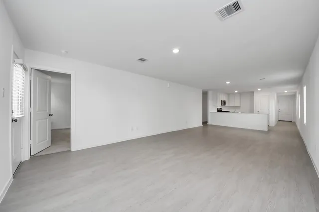 a view of a livingroom and a bathroom