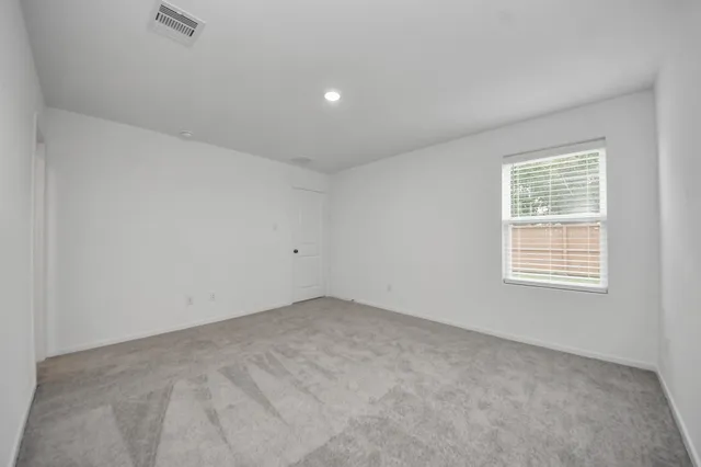 a view of an empty room and window