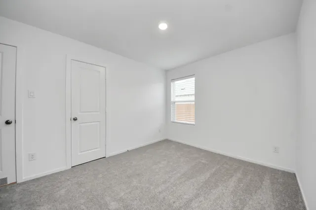 a bathroom with a sink a toilet and a large mirror