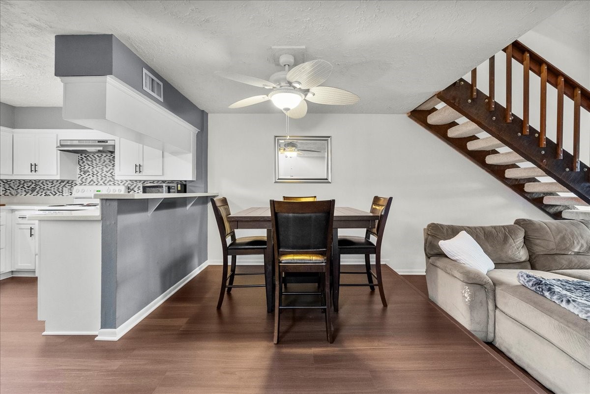 671 Davis Road League City, TX 77573 - Photo 15 of 38 a living room with stainless steel appliances furniture a dining table and a wooden floor