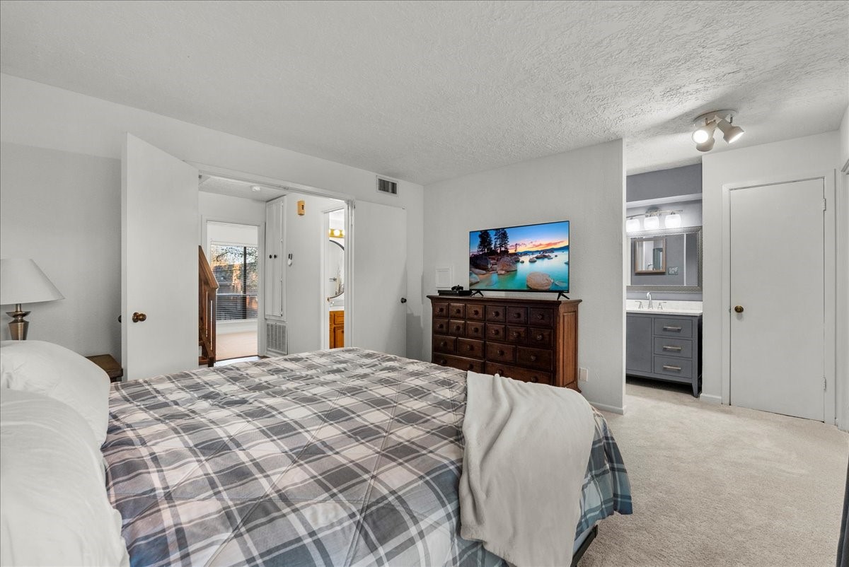 671 Davis Road League City, TX 77573 - Photo 22 of 38 a large bedroom with a bed and dresser