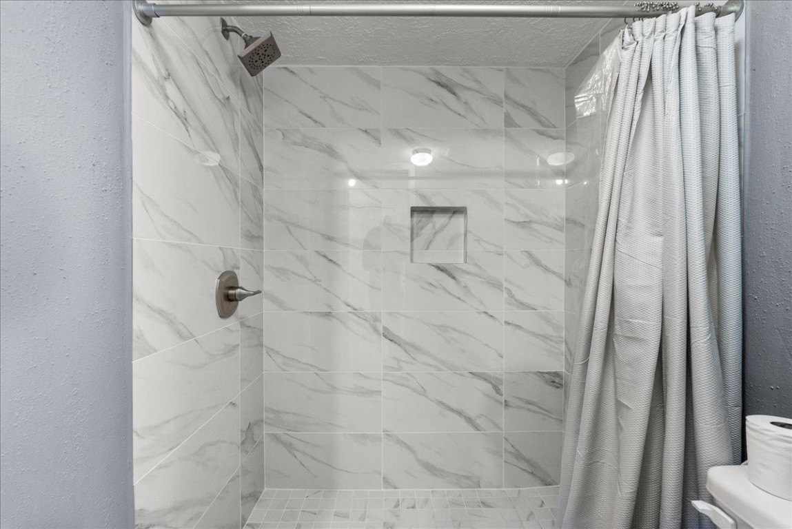 671 Davis Road League City, TX 77573 - Photo 24 of 38 a bathroom with a shower