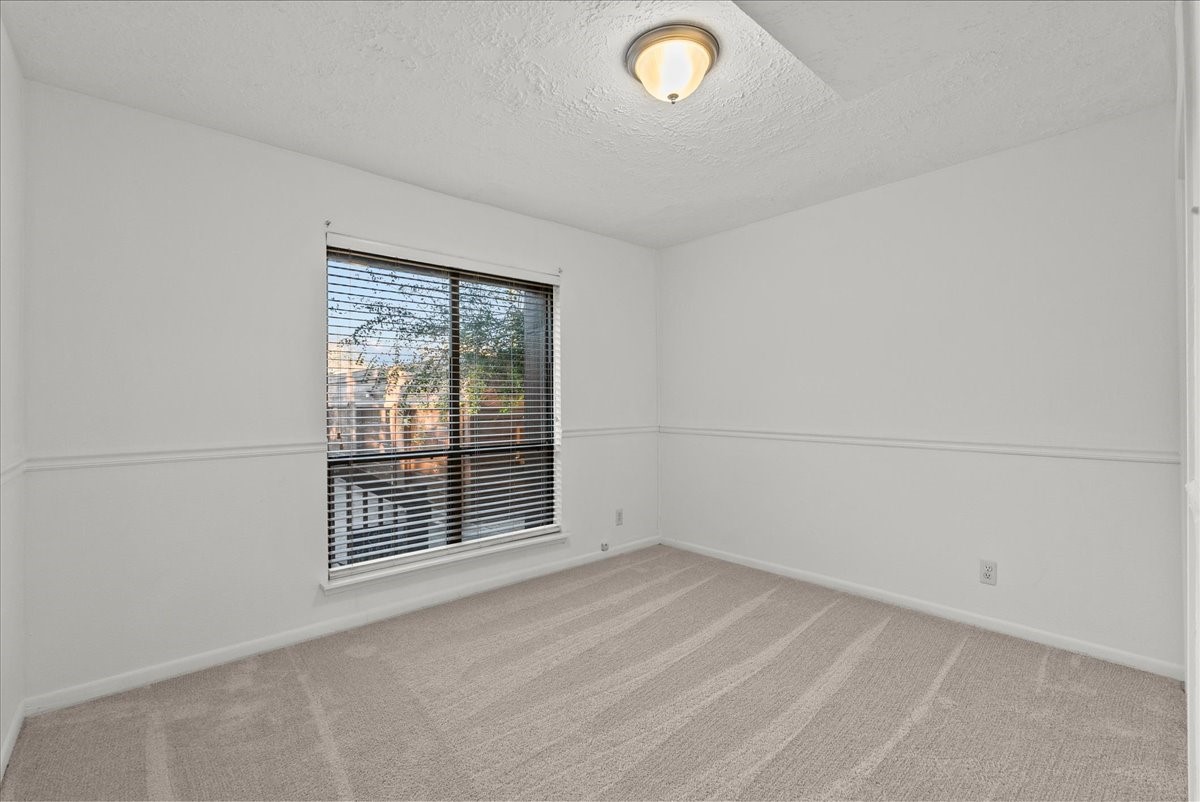 671 Davis Road League City, TX 77573 - Photo 28 of 38 an empty room with windows