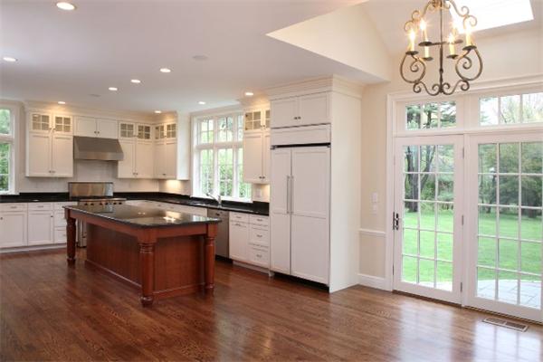 39 Sunset Road Weston, MA 02493 - Photo 2 of 8 a kitchen with stainless steel appliances granite countertop a stove a refrigerator and a view of living room