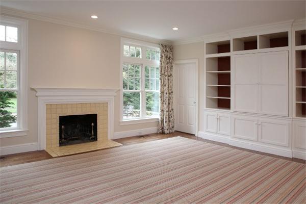 39 Sunset Road Weston, MA 02493 - Photo 4 of 8 a view of an empty room with a window and fireplace