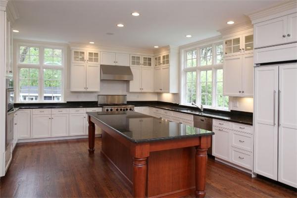 39 Sunset Road Weston, MA 02493 - Photo 5 of 8 a kitchen with stainless steel appliances granite countertop a sink stove and refrigerator