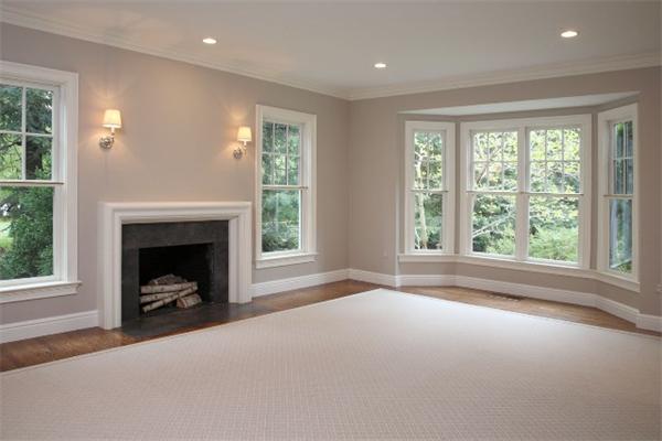 39 Sunset Road Weston, MA 02493 - Photo 6 of 8 a view of a livingroom with a fireplace and a window