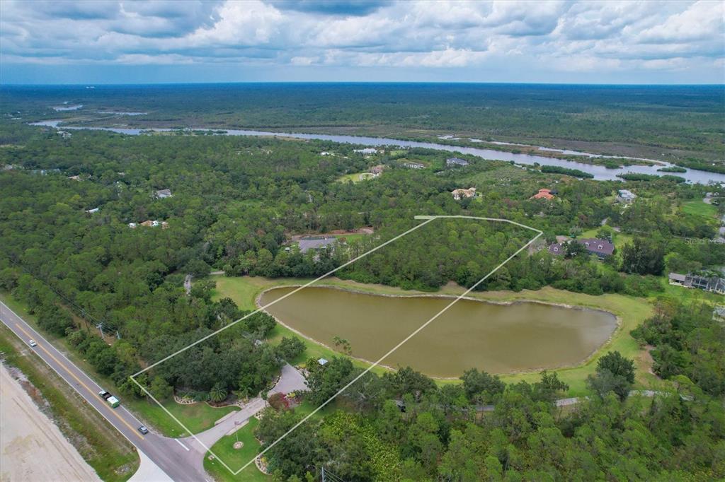 0 North River Road Venice, FL 34293 - Photo 1 of 1 Private Lake and Road frontage among multi million dollar Estates with access to the Myakka River!