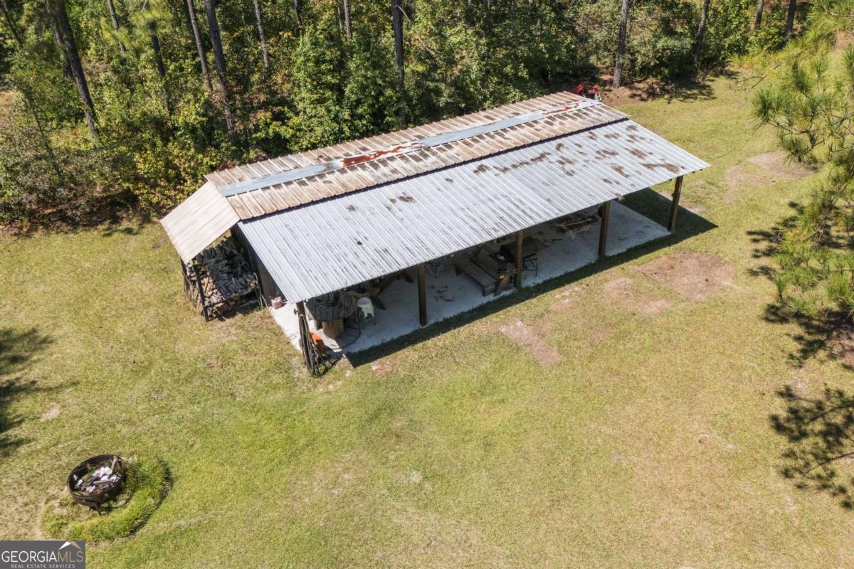 1603 Dl Durrence Road Reidsville, GA 30453 - Photo 5 of 28 a view of a swimming pool with a yard