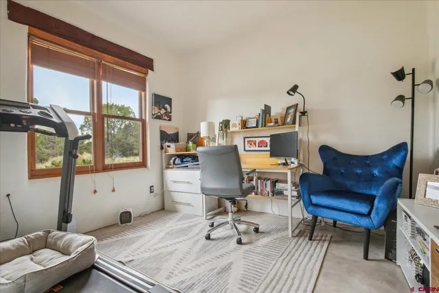 a workspace with furniture window and outside view