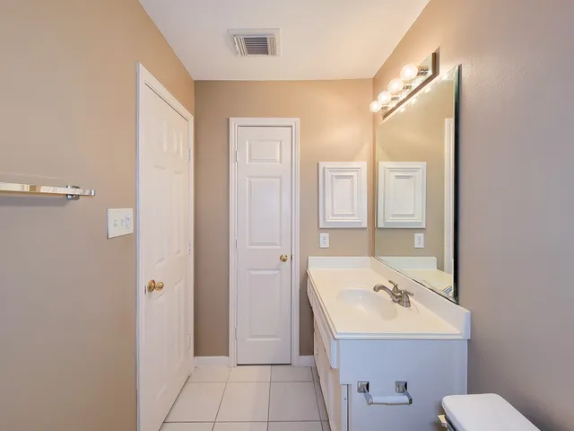 a white toilet sitting next to a bath tub