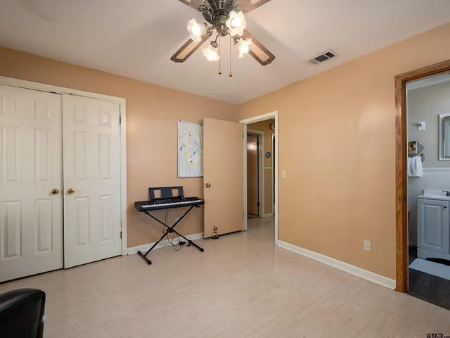 a view of room with workspace and windows