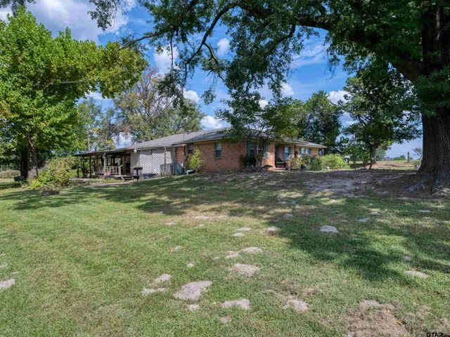 a view of a house with a big yard