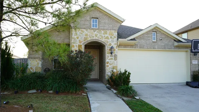 a front view of a house with garden