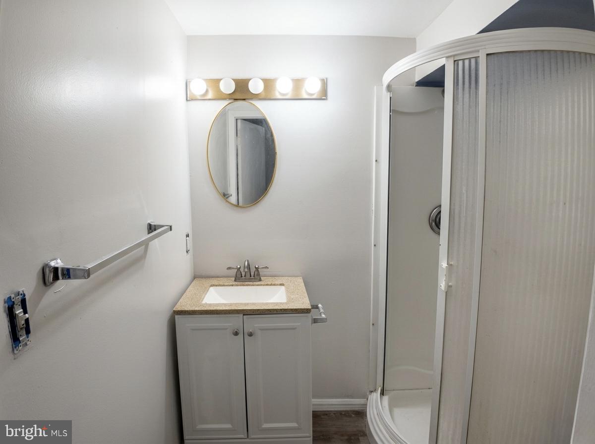 16 Powhurst Court Baltimore, MD 21236 - Photo 12 of 22 a bathroom with a sink and mirror