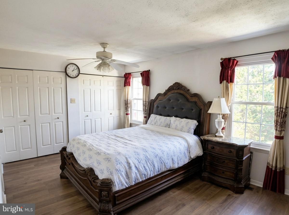 16 Powhurst Court Baltimore, MD 21236 - Photo 14 of 22 a bedroom with a bed mirror and a window