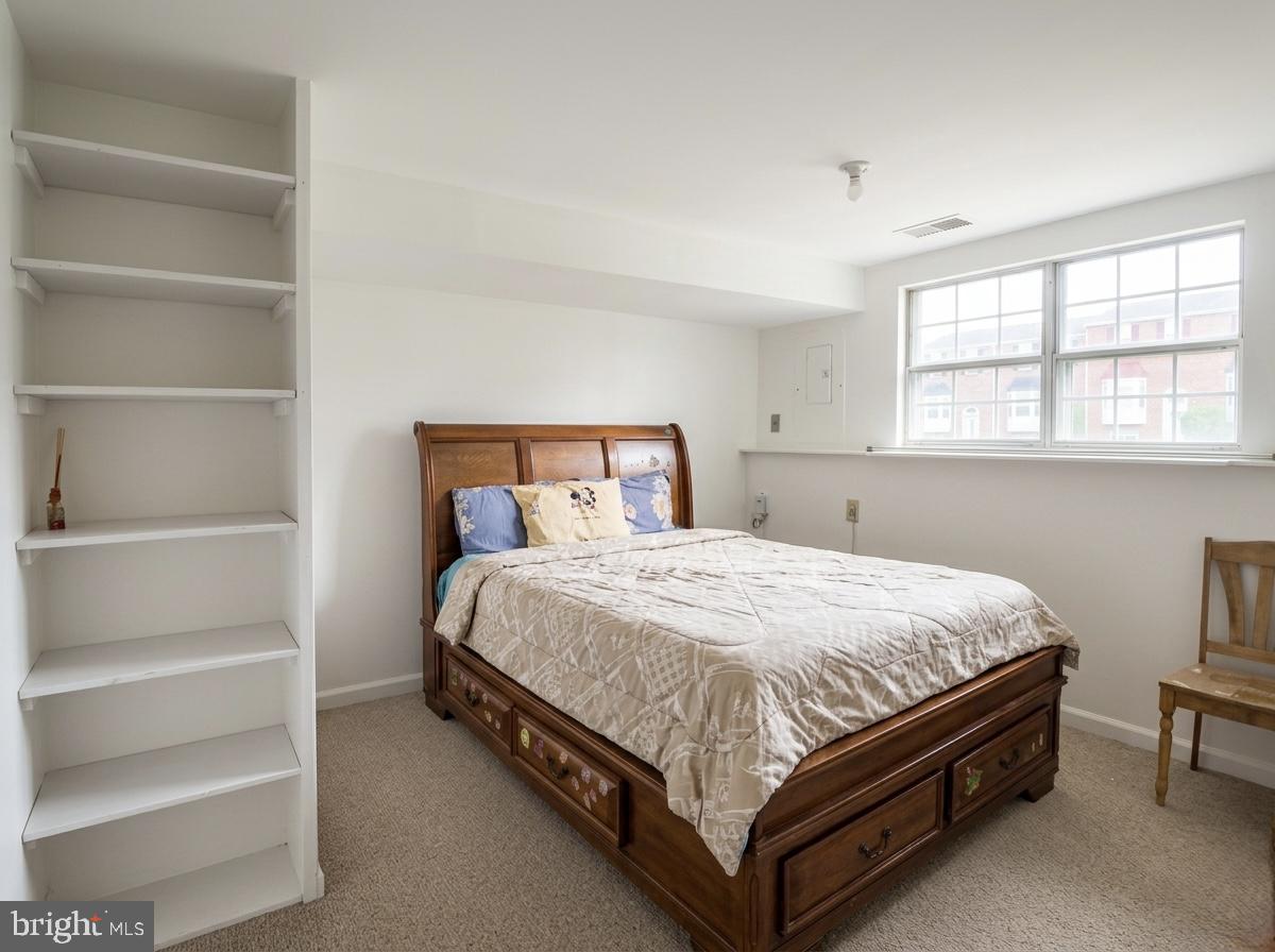 16 Powhurst Court Baltimore, MD 21236 - Photo 18 of 22 a bedroom with a bed and a window