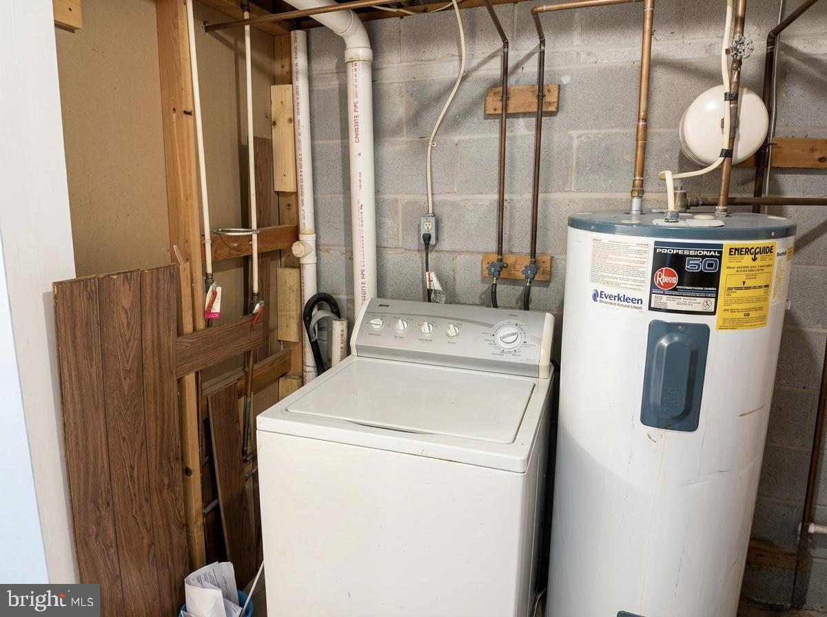 16 Powhurst Court Baltimore, MD 21236 - Photo 19 of 22 a view of washer and dryer with bathroom in the background