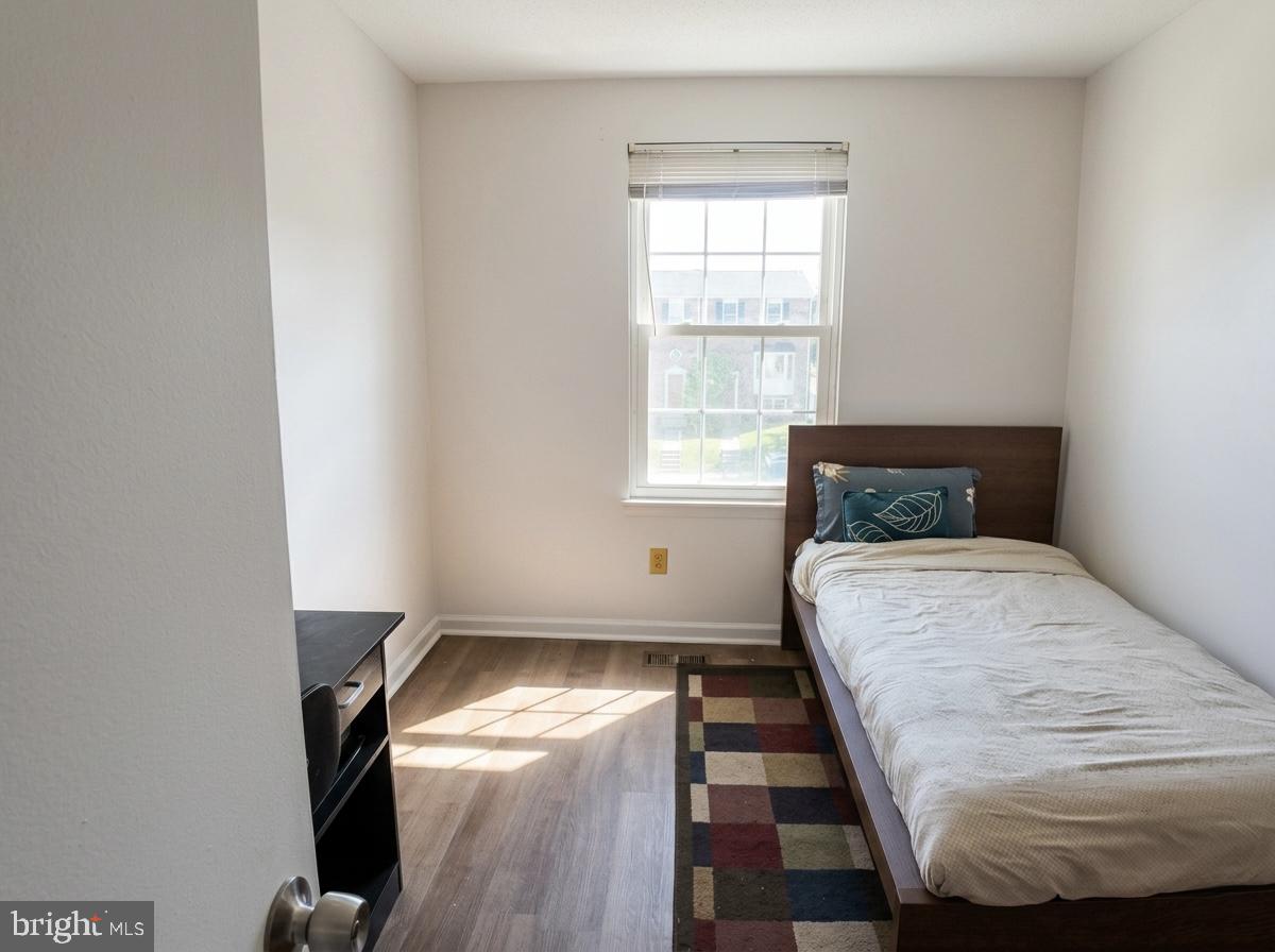 16 Powhurst Court Baltimore, MD 21236 - Photo 10 of 22 a bedroom with a bed and a window