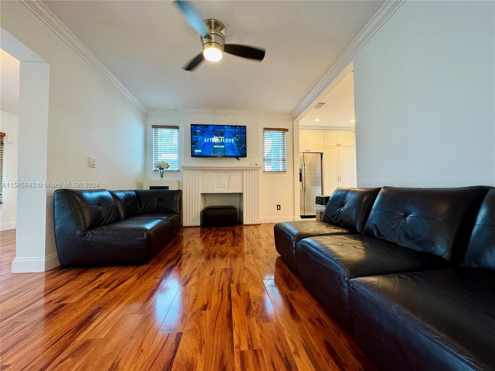 4235 Southwest 14th Street Miami, FL 33134 - Photo 14 of 32 a living room with furniture and a fireplace