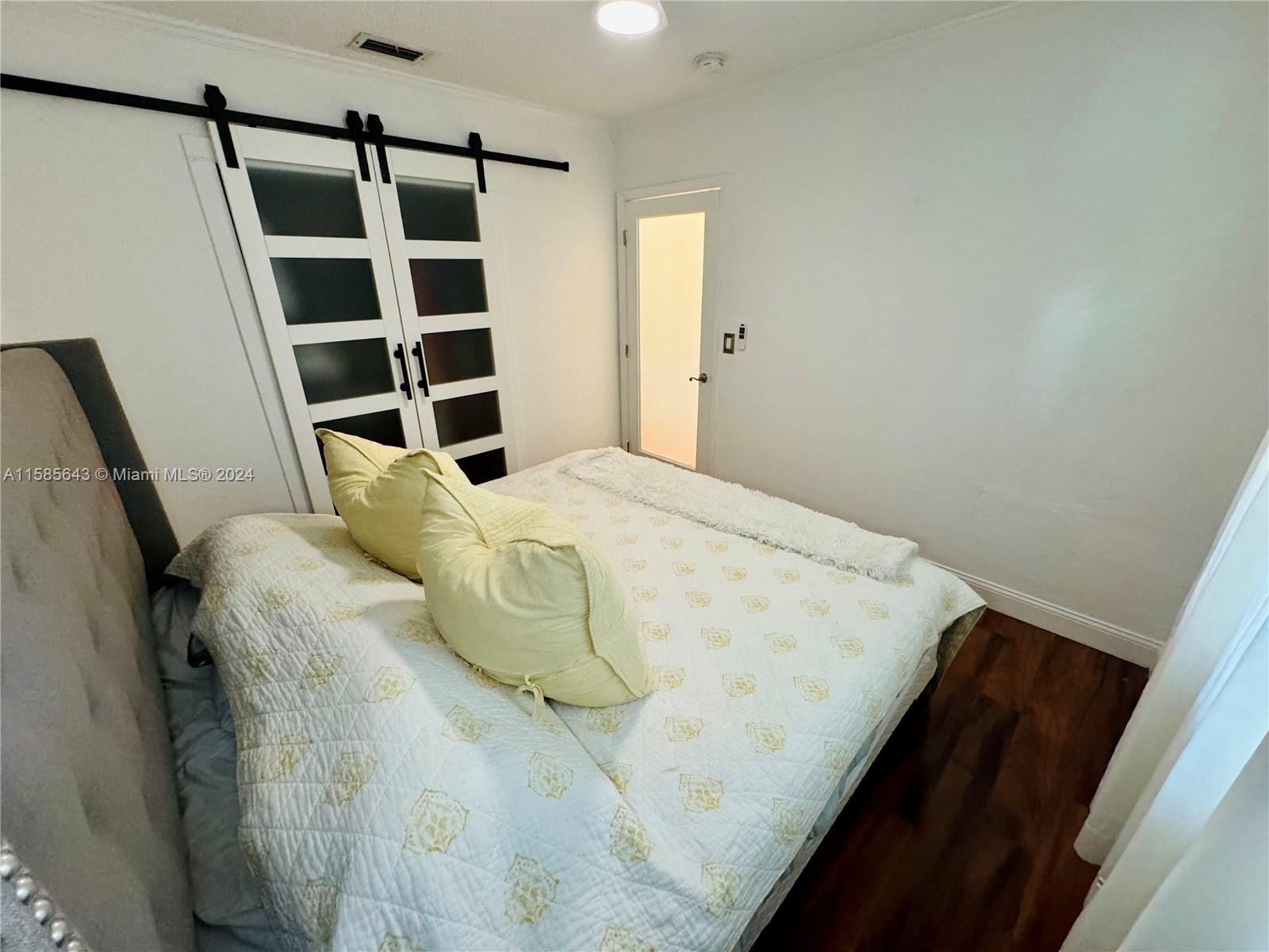 4235 Southwest 14th Street Miami, FL 33134 - Photo 17 of 32 a view of walk in closet with empty racks