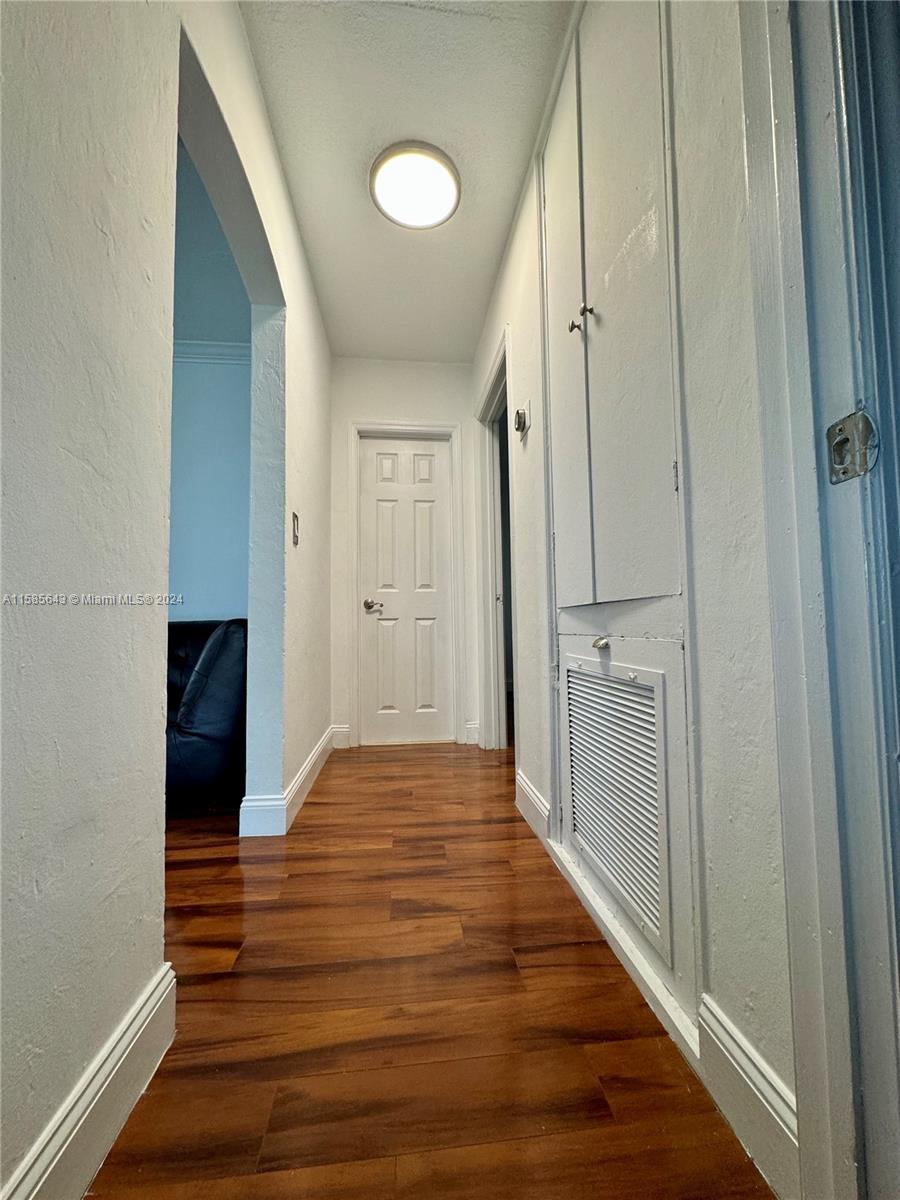 4235 Southwest 14th Street Miami, FL 33134 - Photo 18 of 32 a view of a hallway with wooden floor