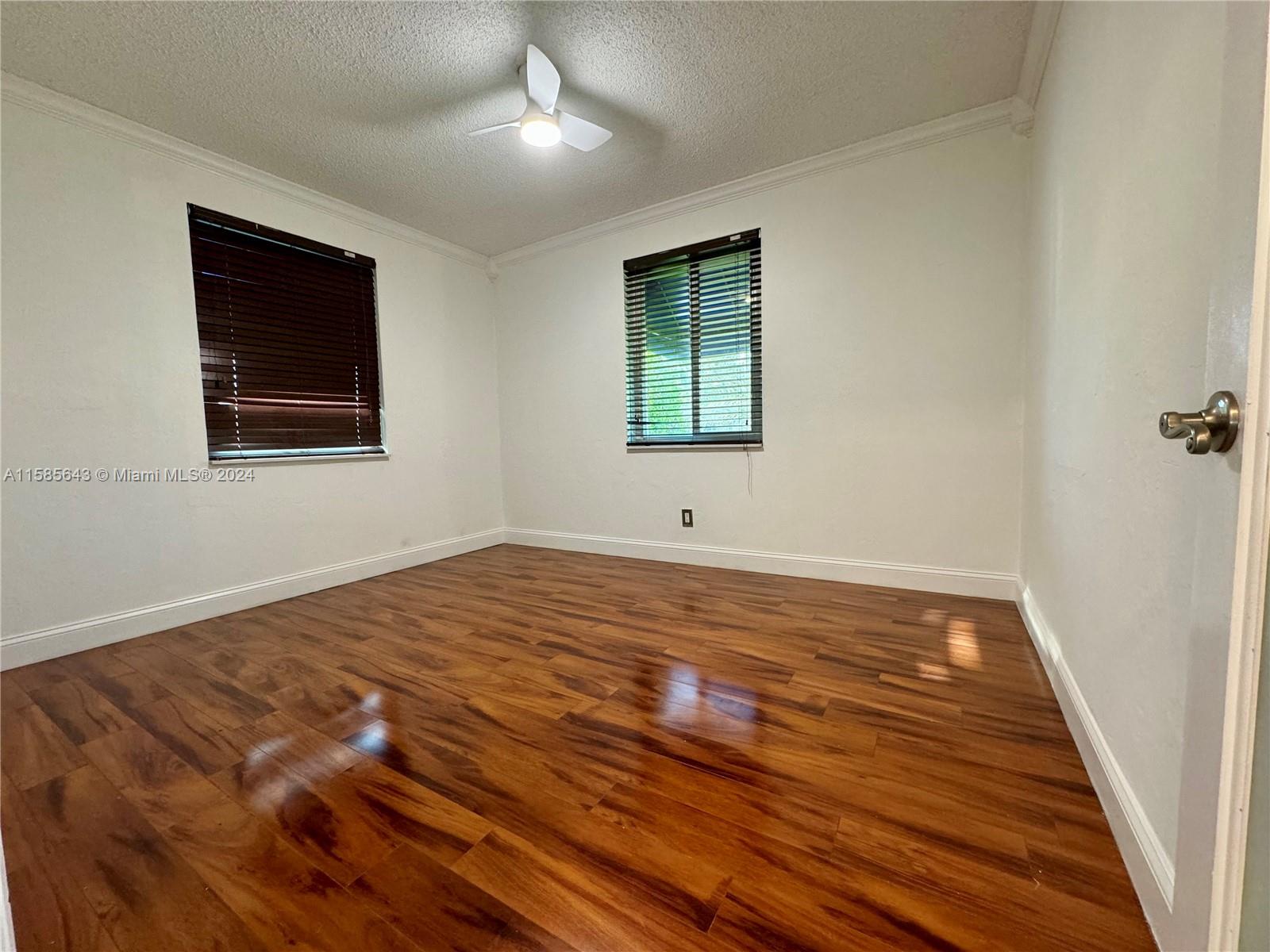 4235 Southwest 14th Street Miami, FL 33134 - Photo 19 of 32 a view of empty room with wooden floor