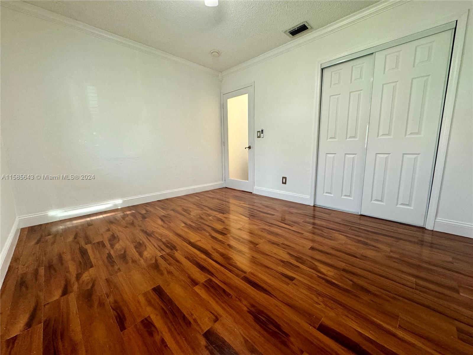 4235 Southwest 14th Street Miami, FL 33134 - Photo 20 of 32 a view of room with wooden floor