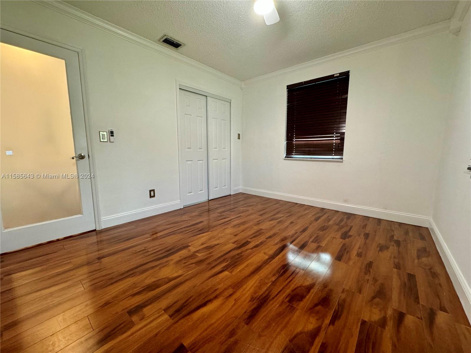 4235 Southwest 14th Street Miami, FL 33134 - Photo 21 of 32 a view of empty room with wooden floor
