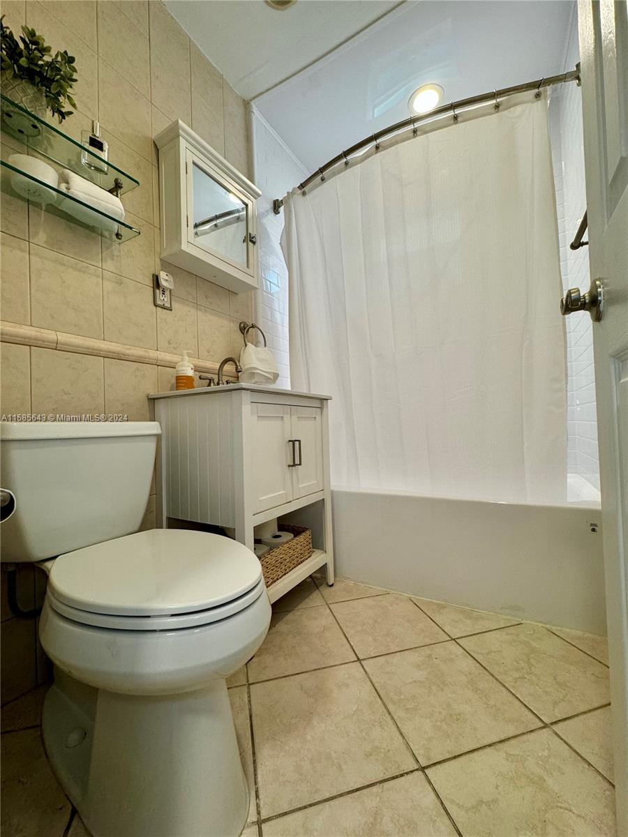 4235 Southwest 14th Street Miami, FL 33134 - Photo 24 of 32 a bathroom with a toilet and a shower