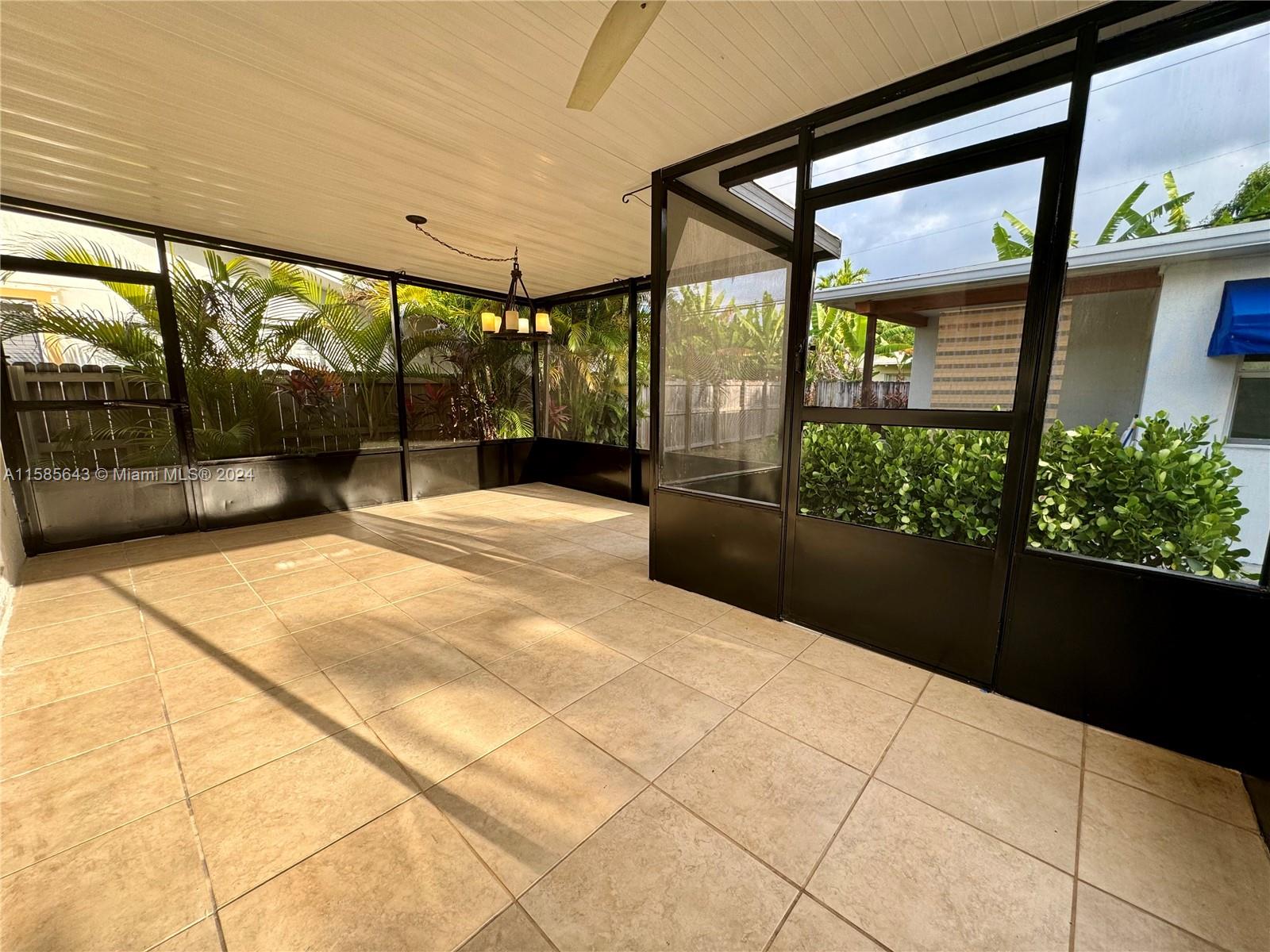 4235 Southwest 14th Street Miami, FL 33134 - Photo 26 of 32 a swimming pool with potted plants in front of it