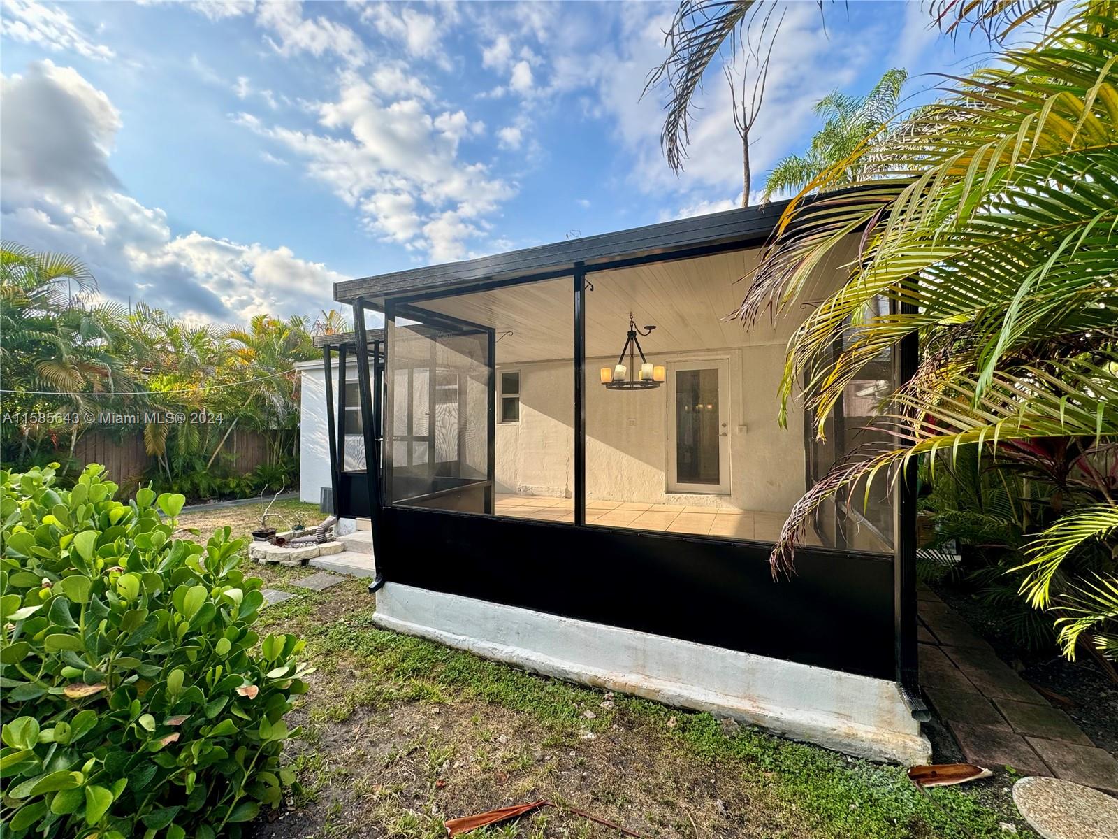 4235 Southwest 14th Street Miami, FL 33134 - Photo 28 of 32 a front view of a house with a yard