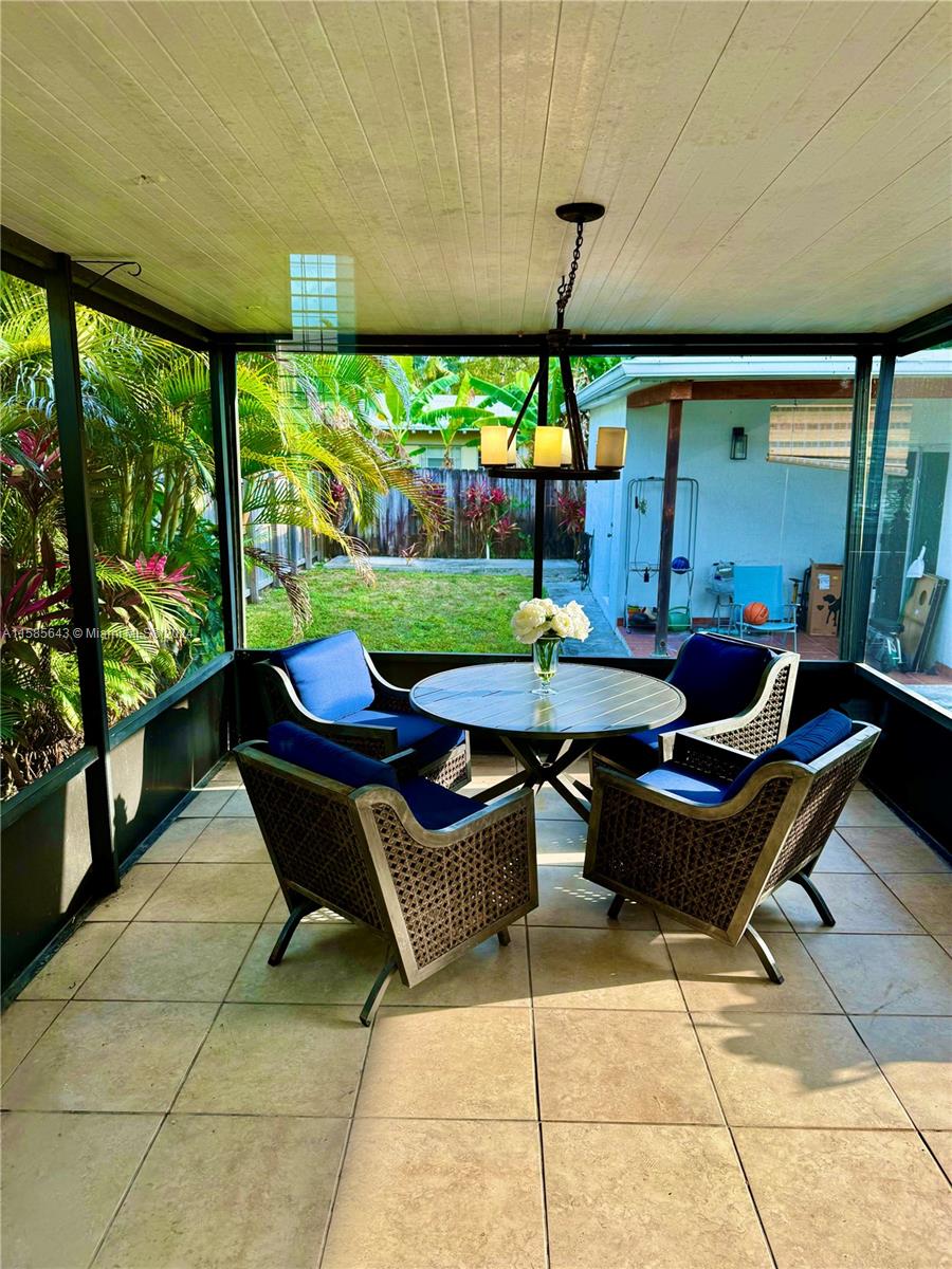 4235 Southwest 14th Street Miami, FL 33134 - Photo 31 of 32 a outdoor living space with furniture and garden view