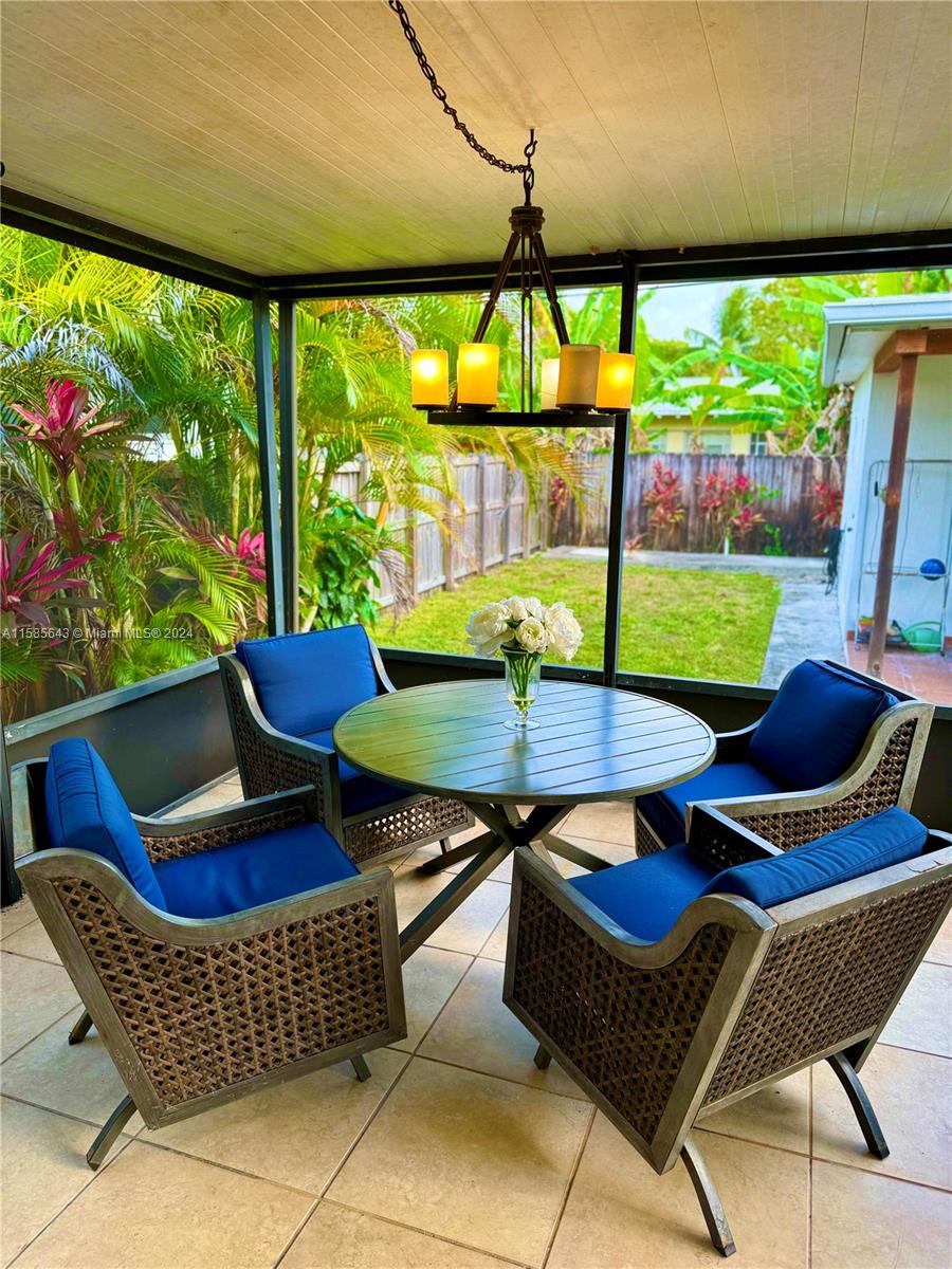 4235 Southwest 14th Street Miami, FL 33134 - Photo 32 of 32 a view of an chairs and table in the patio