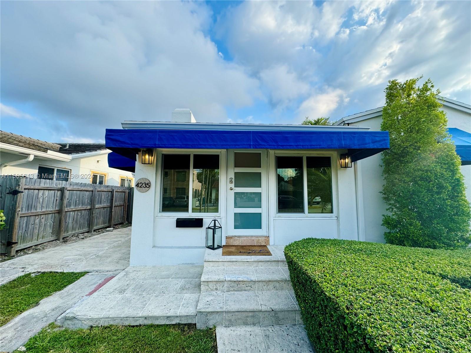 4235 Southwest 14th Street Miami, FL 33134 - Photo 7 of 32 a front view of a house with a garden